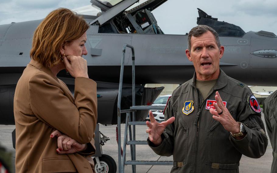 U.S. Air Force Brig. Gen. John Gallemore, right, 18th Wing commander, briefs Petra Sigmund, Director General for East Asia, Southeast Asia and the Pacific at the Federal Foreign Office, while touring the flight line.